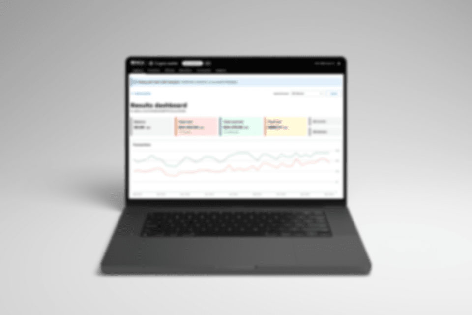 A blurred image of a website dashboard mockup on a Macbook pro